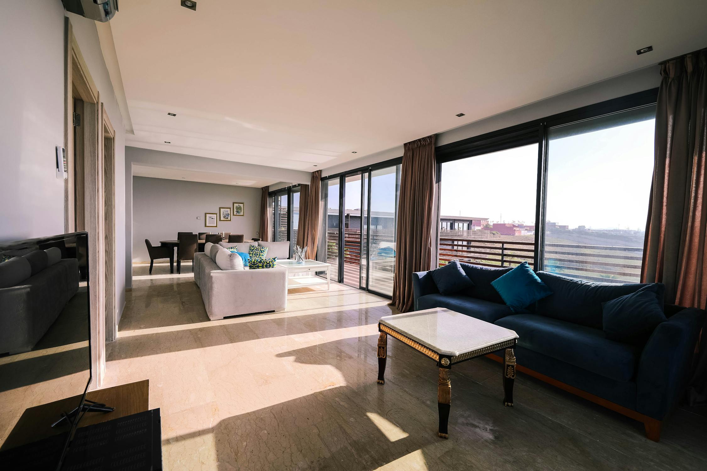 Open living space with floor-to-ceiling windows after a complete home renovation